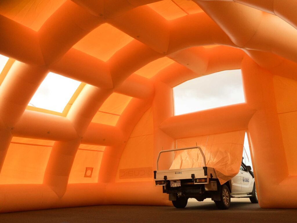 The inflatable temporary workshop innate height and built-in windows allow for natural light work conditions.