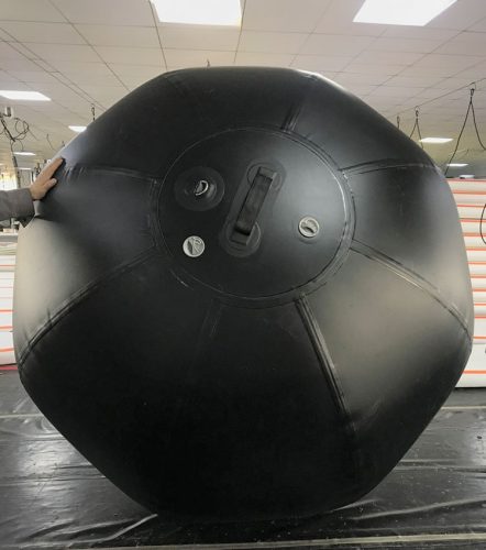 A round-shaped low-pressure plug up isolation plug designed to be lowered into a pipe.